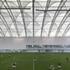 The football pitch roof uses an asymmetric arch profile
