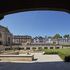 The courtyard slopes down on a diagonal axis to the library’s main entrance