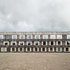 The facade features vertical oak boards reclaimed from the floors of railway carriages