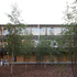 The building echoes the existing Brutalist courtyards of the college