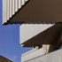 The perforations allow for the balcony appearance to constantly shift from opaque to translucent
