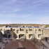 The courtyard is partly sunk into an existing slope with terraces facing each other