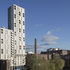 The external walls are predominantly a white brick tile cladding