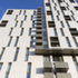 The towers are clad with white Corium, a brick tile cladding system manufactured by Wienerberger