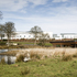 The site is circled by mature lime and Scots pine trees