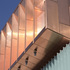 The original cinema entrance at the south-eastern end is now supplemented by a new theatre entrance at the point where old meets new, marked by the copper ‘head’ of the studio theatre above