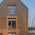 On the upper levels of the building the colour tones of the corduroy brick panels change, with the dark-red brick coming to the foreground, contrasting with a Staffordshire Blue brick in the background