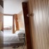The timber wall and roof panels are lined with acoustic rubber underneath birch plywood battens