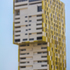 The development features bold, pixel-like colours