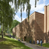 The brick surfaces are animated by panels in relief and textured patterning, giving each segment of building a distinctive appearance