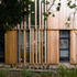 The austere facade is alleviated by solar shading