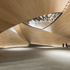 The foyer space is formed by curved timber shells