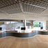 The main reception carves a column-free space under the ramp between ground and level 2, introducing a three-dimensional structural vortex form