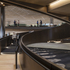 A twisting trefoil staircase ascends ramp-like through the centre of the building
