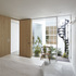 A spiral staircase leads down to a basement extension
