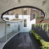 Under the roof a garden room offers a living space for the home and a meeting space for the studio