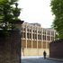 Rather than a simple reclad, elements of the original façades have been kept visible in the thin vertical piers of brick and stone cappings that rise up through the building’s four storeys