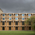 Both façades use oak glulam