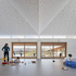 The nursery school forms three sides of a cloistered court, with the community centre forming the fourth side