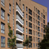 The architecture is united by shared masonry details, roof claddings, window types and proportions
