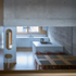 The palette of materials comprises exposed concrete, bespoke joinery, brick envelope and anodised aluminium windows