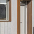 Protruding Cor-ten cowls to the front door and kitchen window reveals