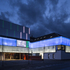 The facade is formed of translucent low-iron content cast glass planks, made by Linit, supported within a powder-coated steel edge frame