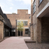 Fletton brickwork, previously hidden inside the hall, is now the yard’s primary material language