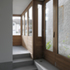 Internally at ground level, the core divides the plan into four public rooms: a hall/library, kitchen, dining and living room
