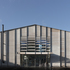 The original three-bay steel portal frame of the agricultural shed was extended longitudinally and vertically and propped with internal columns