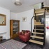 grand_entrance_to_small_house