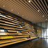 Irregularly angled oak boards clothe the reception volume