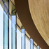 The glazing grid is approximately 2m, with the angles of the glass panels changing along the elevation to follow the curved geometry of the slate roof above