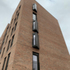 The architect references the tenements of New York and Glasgow