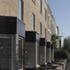 Surrounding the site are terraces of two and three-storey brick houses