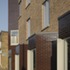 The brief was to provide seven family homes arranged as houses in a terrace, three for private sale and four for social rent