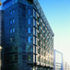 The bronze facade offers the gravitas of stone