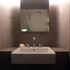 Shower room basin set into a carved niche