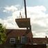 craning the concrete roof over the main house