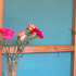 Hardboard has been placed with the rough side outwards to add texture.  The boards were cut with a Stanley knife to fit between the frames, painted and are then held in place with brass cup hooks
