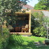 The project sits on a mound (existing) at the end of a terraced garden, overlooked from the left by another terraced street