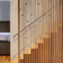Timber fin wall against stairway 