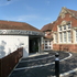View of listed building retained on approach to school