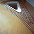 Detail of carved hole between sculpted tread floorboards