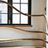 Detail of stair handrail merging with window