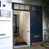 Dual entrance via the original pair of doors. The ground floor studio entrance is via a sheltered, internal corridor; the flat is accessed by the smaller door.  