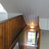 Top floor stairs going down from the open plan top floor living spaces, to the bedrooms and bathrooms below. (Phase II - masionette)