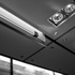 The bespoke clothes rail arrangement was based on a sliding glass door mechanism. The glass ‘door’ in effect was cut short, to create a suspended glass ‘fin’ onto which a polished stainless steel pole was attached below it.