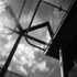 Cruciform columns are clad in mirror-finished stainless steel, used alongside the reflective properties of the glass, as part of a surface strategy for making the architecture appear ethereal, against the stately brickwork.