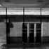 The perimeter detailing creates uninterrupted floor-to-ceiling views of the existing brickwork context.